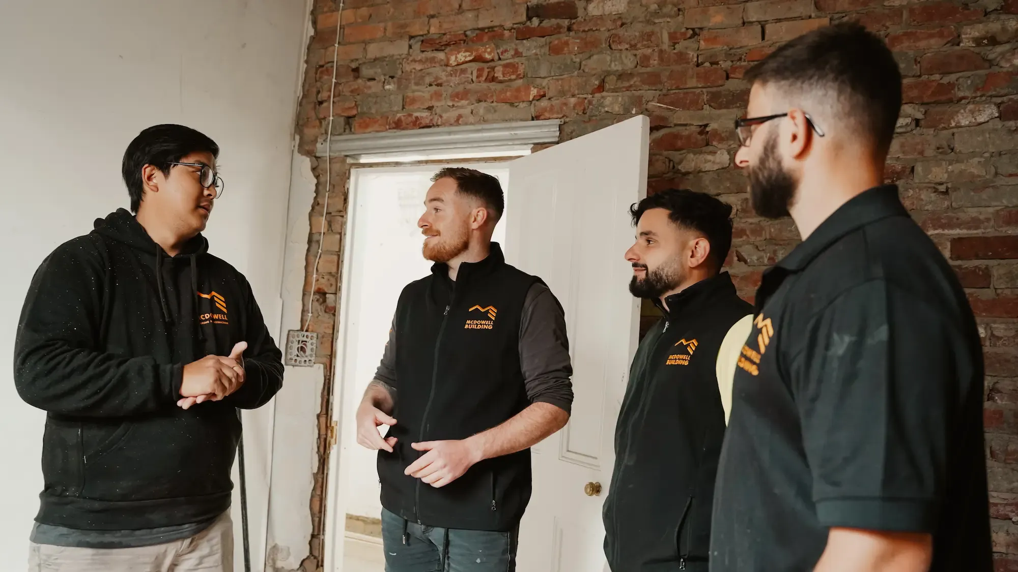 McDowell Building & Construction team discussing the next steps for a renovation project