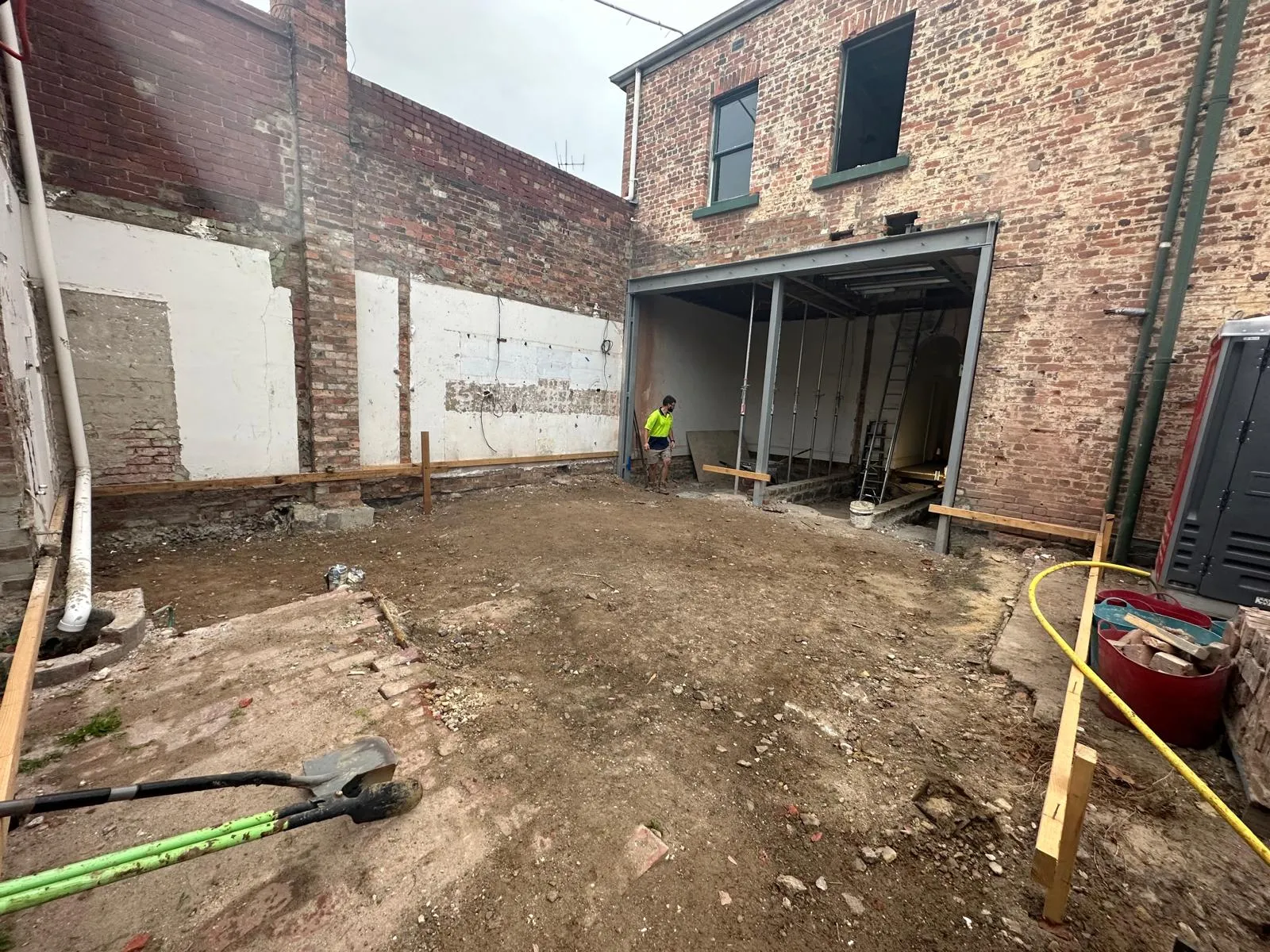 Solid brick walls exposed during a Carlton wall removal