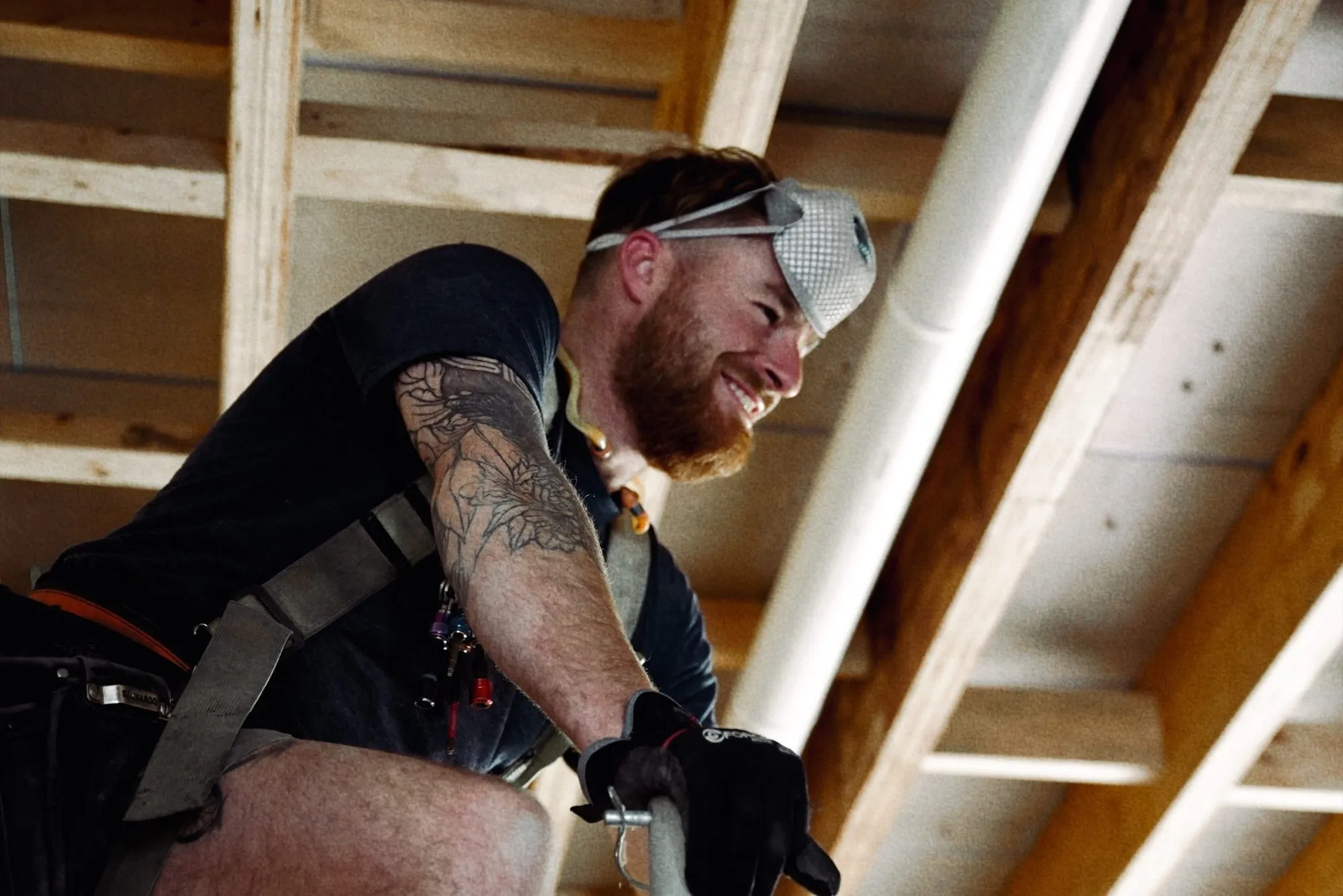 A carpenter setting out framing by hand on site